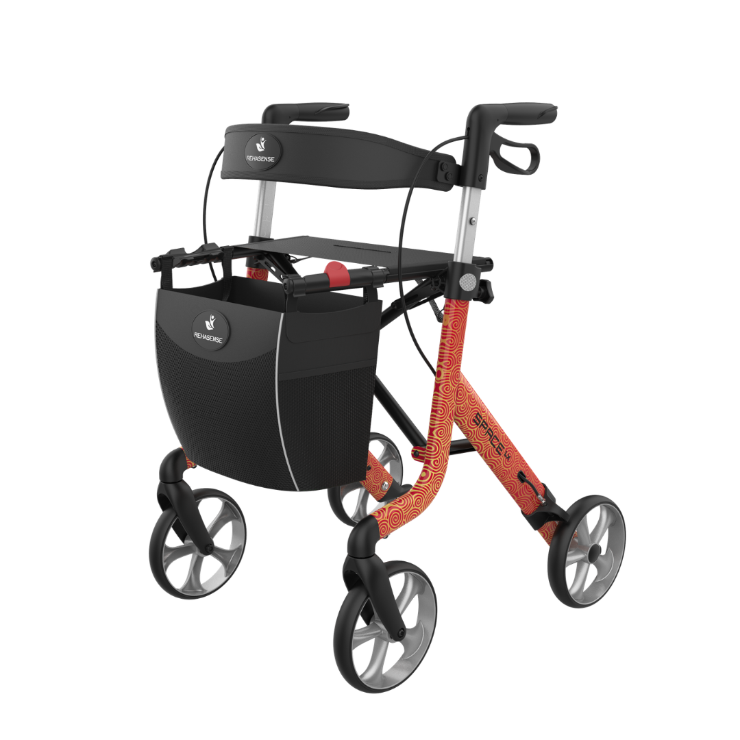 The Rehasense Space LX Art Deco Ultralight Rollator features a designer orange patterned frame, four large wheels, black seat, storage bag, hand brakes, and lightweight aluminium build for easy and stylish mobility support.